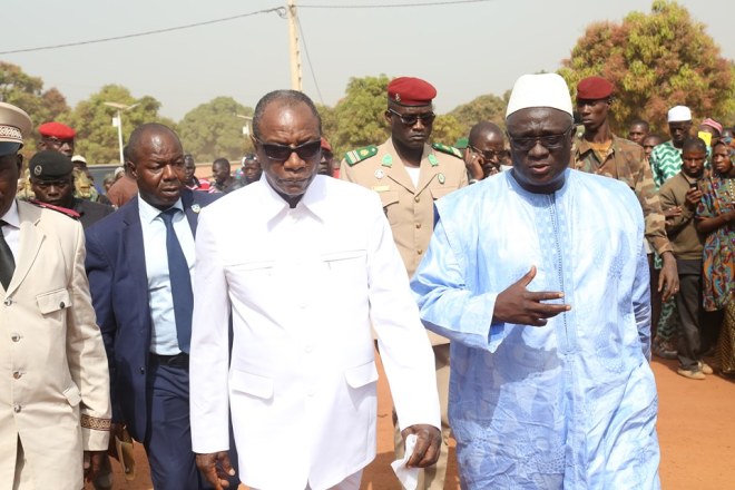Alpha Condé, Président de la République de Guinée et Dr Moussa Konaté de la PCG