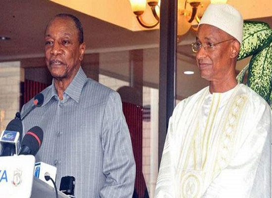 Alpha Condé, président de la République de Guinée et son principal opposant Cellou Dalein Diallo